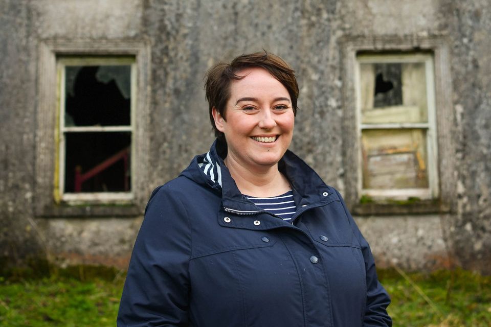 Presenter Maggie Molloy outside a run-down house in Kilcommon, County Tipperary. Photo: Diarmuid Greene