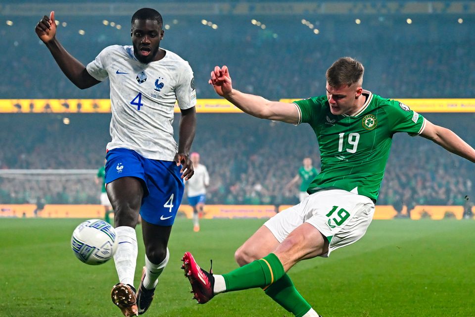 Ireland's Evan Ferguson in action against Dayot Upamecano of France during the Euro 2024 qualifier at Aviva Stadium in Dublin. Photo by Stephen McCarthy/Sportsfile