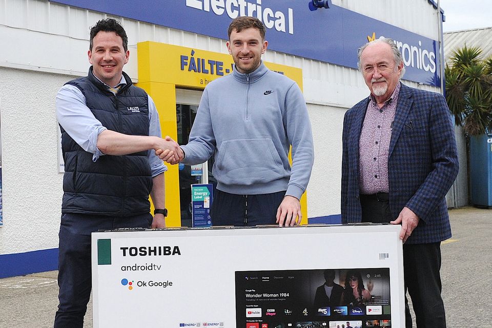 Jamie and Jim Lally present Sam Mulroy, Louth’s man of the match in the Leinster final, with a 55-inch Toshiba TV sponsored by Lally’s Electrical.