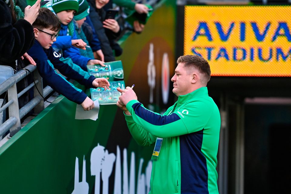 Ireland's Tadhg Furlong signs autographs for supporters before the Six Nations match against Italy at the Aviva Stadium in Dublin. Photo by Ben McShane/Sportsfile