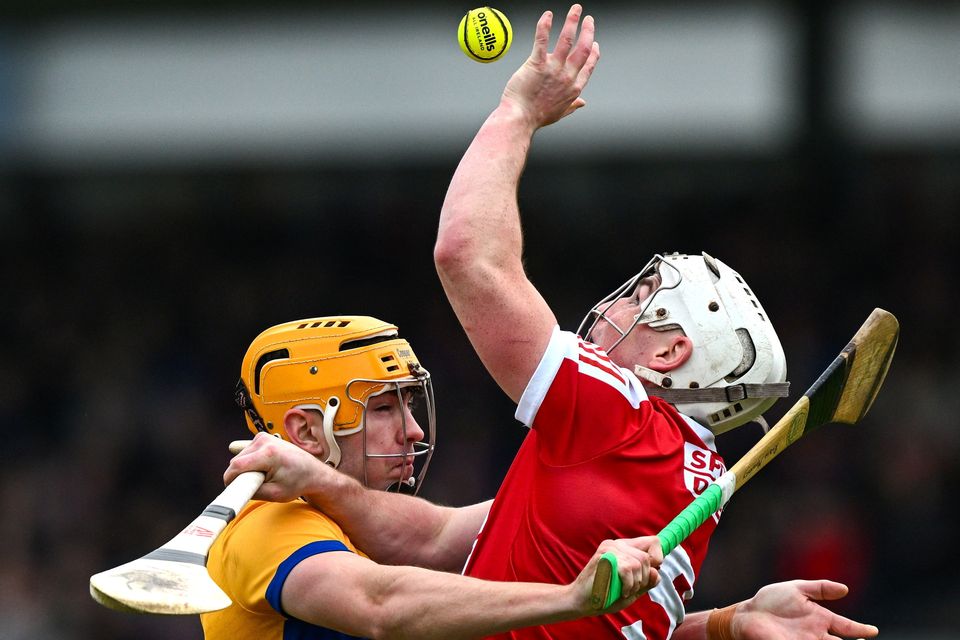 Cork’s Tommy O’Connell of is tackled by Robin Mounsey of Clare during their Division 1 Group A league match at Cusack Park in February. Photo: Ray McManus/Sportsfile