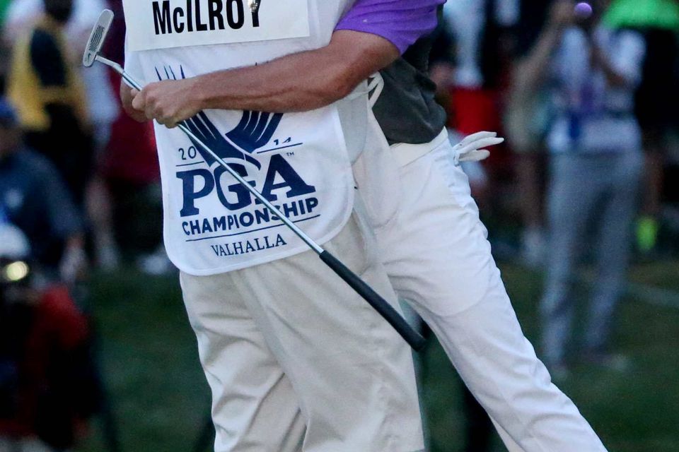 Rory McIlroy celebrates with his caddie J.P. Fitzgerald aftet his win. Photo: Getty Images