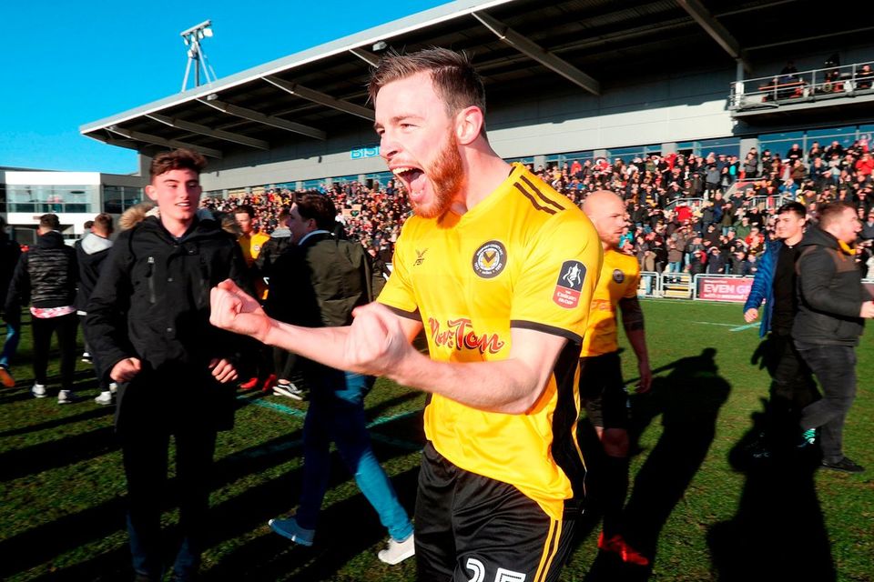 Newport County's Mark O'Brien celebrates victory after the Emirates FA Cup, Third Round match at Rodney Parade