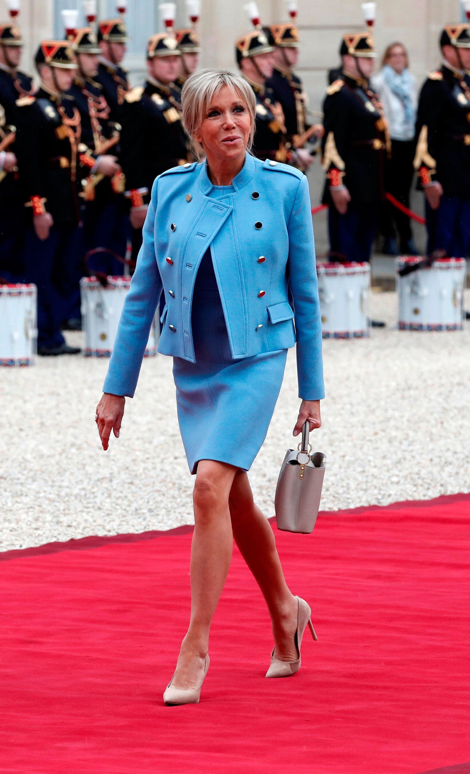 Daily Express on X: Brigitte Macron shows off slim legs in fitted blue  dress while meeting Chilean President    / X