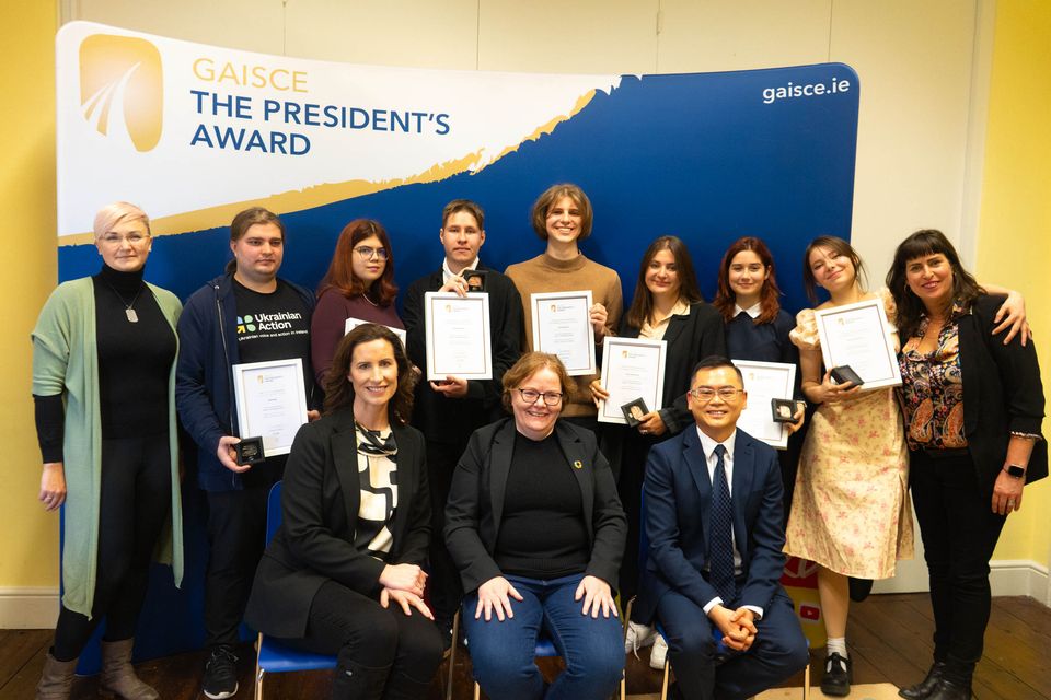 Seven young people from Ukranian Action in Ireland receiving their Gaisce Silver and Bronze awards from Gaisce CEO Avril Ryan and Gaisce Council members Samantha Briody and Vincent Teo in December 2023.