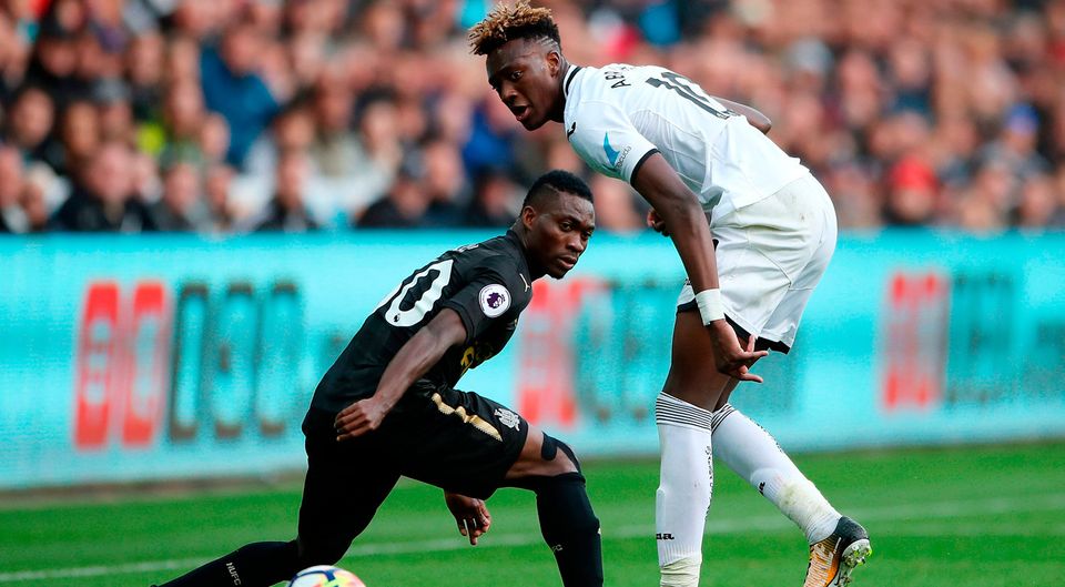 Swansea City's Tammy Abraham (right) and Newcastle United's Christian Atsu (left) in action. Photo credit: Nick Potts/PA Wire