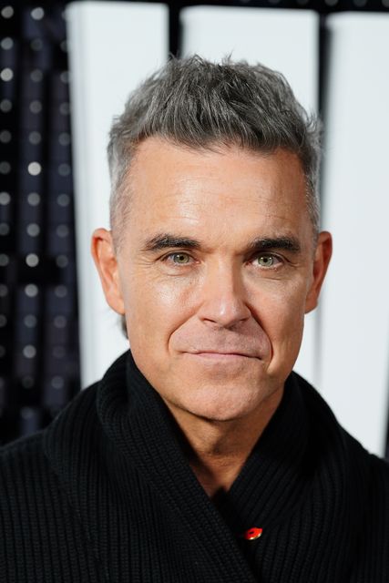 Robbie Williams will headline on July 6 (Ian West/PA)
