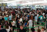 thumbnail: Passengers queue at Barcelona's El Prat airport as security agents strike on August 4, 2017, in Barcelona.