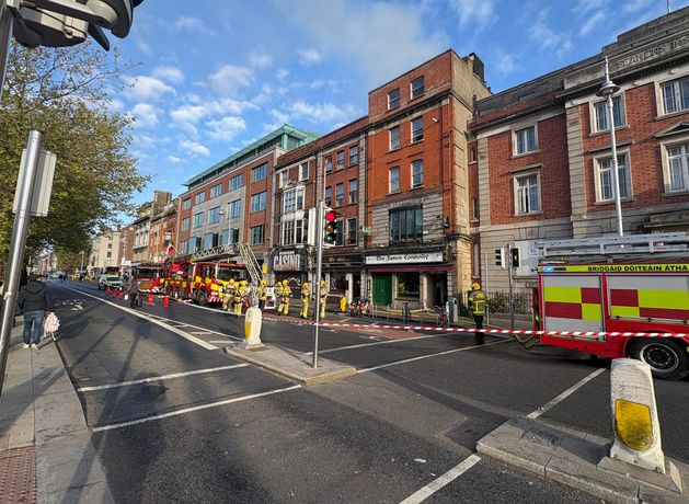 Two people hospitalised after fire at pub in Dublin city centre; Luas line out of service and commuters warned of delays