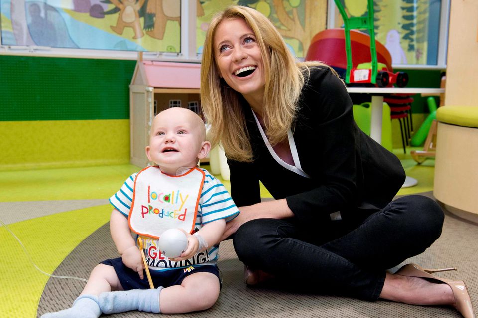 Pictured is Aaron Quinless- O'Brien age 14 months from Enniscorthy with Sky Sports presenter and Irish Independent columnist Rachel Wyse on St John's Ward in Crumlin Children's Hospital. Photo: El Keegan