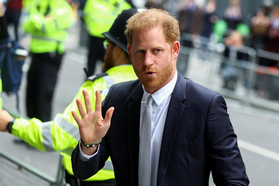 Britain's Prince Harry entering the High Court in London during the phone-hacking trial. Photo: REUTERS/Hannah McKay.