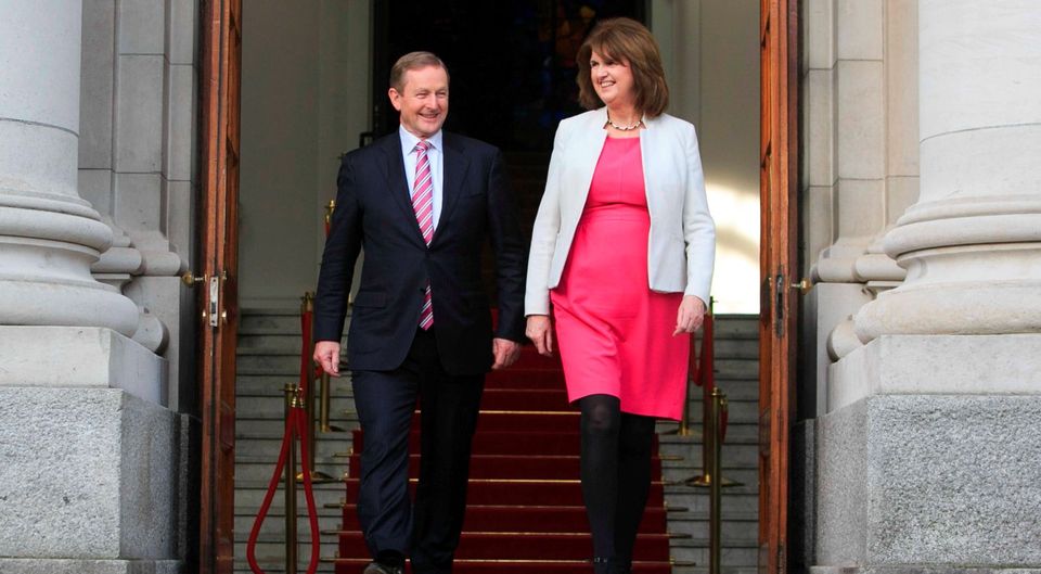 Taoiseach Enda Kenny TD & Tanaiste Joan Burton TD following a dissolution of the Dail at Government Buildings, Dublin. Photo: gareth chaney Collins