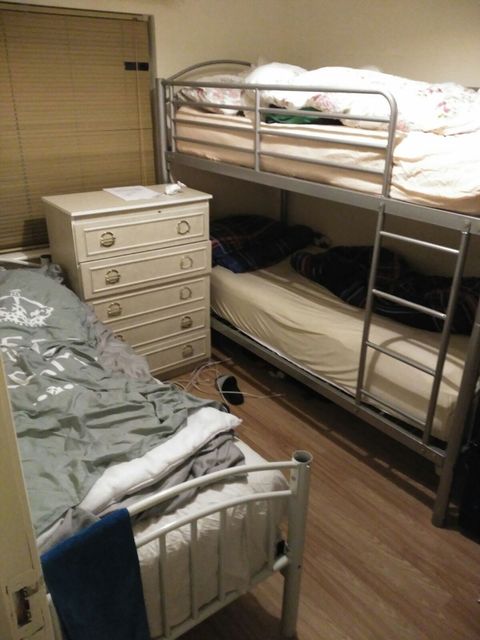 One of the bedrooms where three people sleep