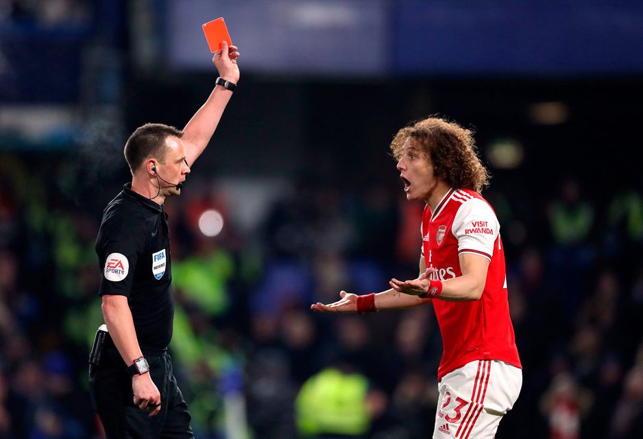 Arsenal's David Luiz is shown a red card by referee Stuart Attwell during the Premier League match at Stamford Bridge, London