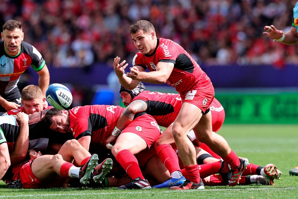 Antoine Dupont of Toulouse passes the ball