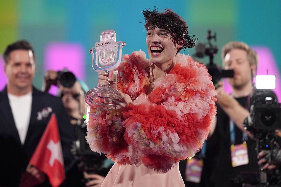 Nemo celebrates his win with a crown of thorns given to him by Ireland’s Bambie Thug (Martin Meissner/AP)