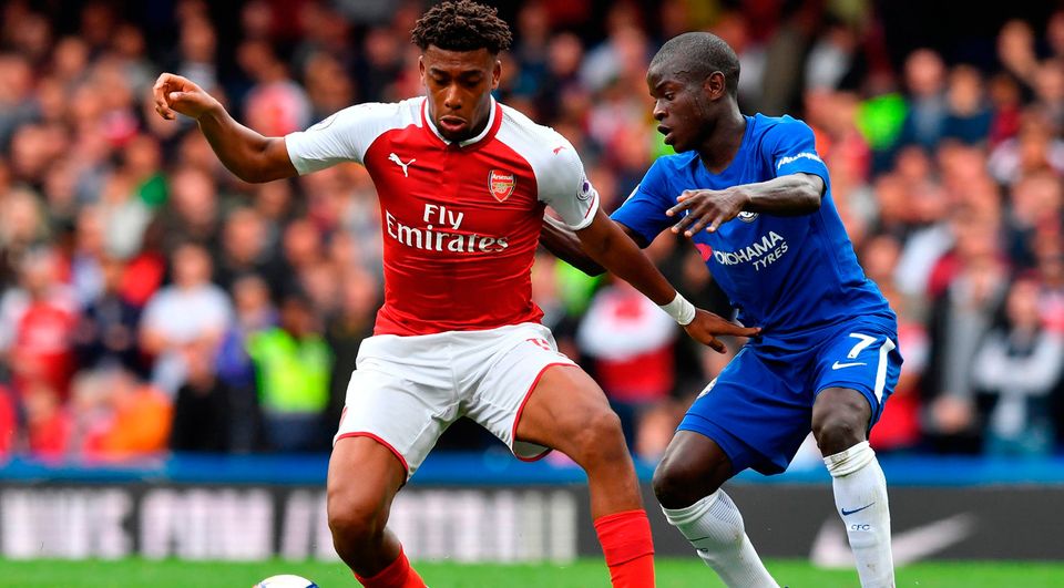Arsenal's Nigerian striker Alex Iwobi (L) vies with Chelsea's French midfielder N'Golo Kante. Photo; Getty Images