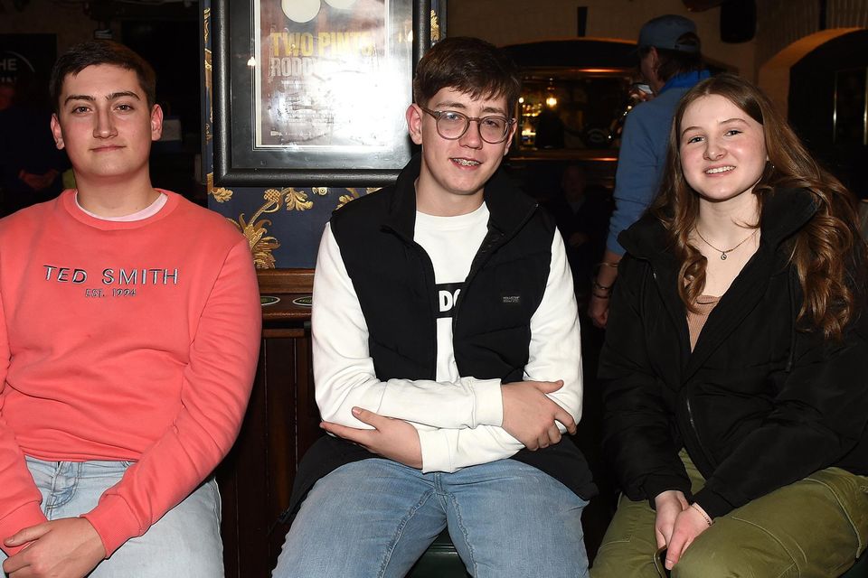 Andrew and Christian Holly and Amelia Campbell at the benefit gig for MND in Sarsfield’s. Photo: Colin Bell Photography