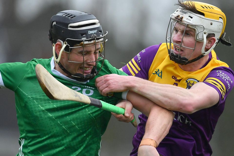 Gearoid Hegarty of Limerick under pressure from Ian Carty of Wexford.