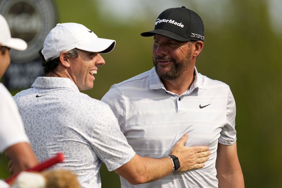 Rory McIlroy, left, congratulates Michael Block for the latter’s hole-in-one during the final round of the PGA Championship tournament at Oak Hill Country Club (Abbie Parr/PA)