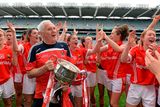 thumbnail: 28 September 2014; Cork manager Eamon Ryan and the team celebrate with the Brendan Martin Cup after the game. TG4 All-Ireland Ladies Football Senior Championship Final, Cork v Dublin. Croke Park, Dublin. Picture credit: Brendan Moran / SPORTSFILE