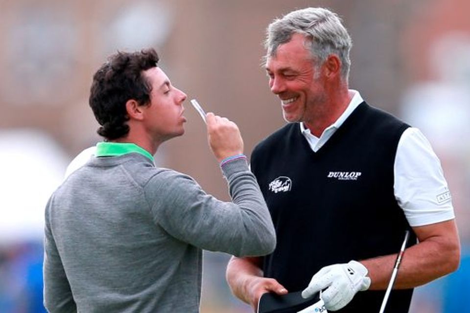 File photo dated 16-07-2014 of Northern Ireland's Rory McIlroy (left) celebrating winning a private bet with Northern Ireland's Darren Clarke during practice day four of the 2014 Open Championship at Royal Liverpool Golf Club, Hoylake