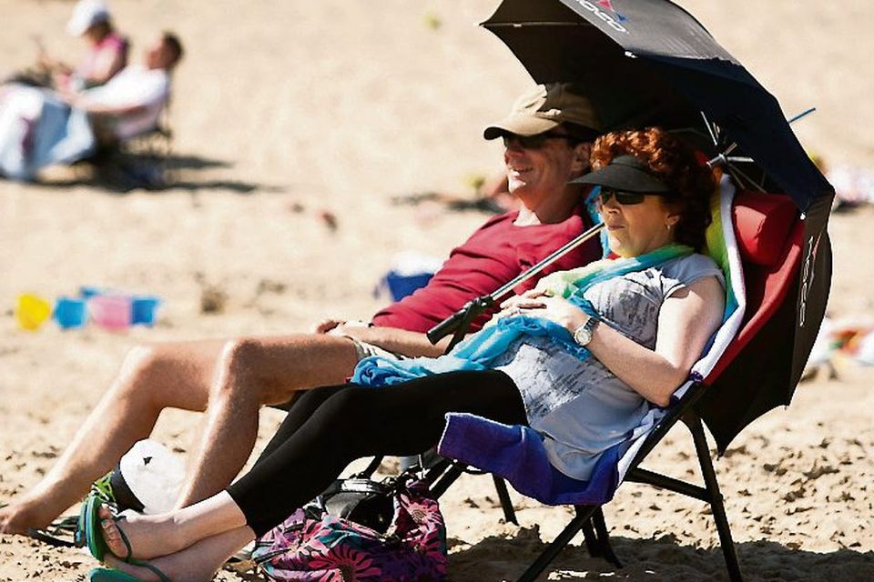 Gerrard McCarthy and Linda Walker enjoy the blazing hot sunshine on Brittas Bay