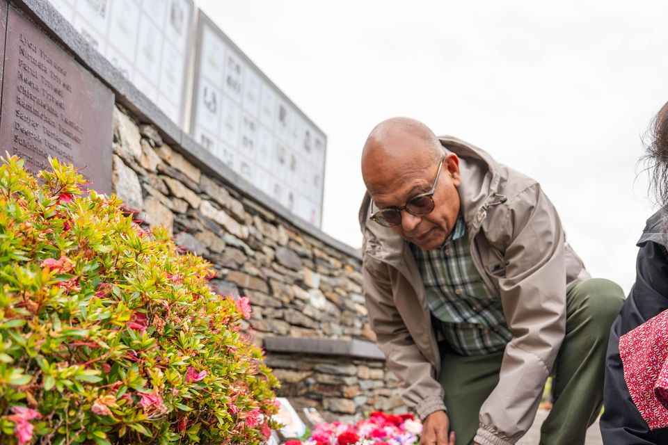 Sunil and Faroj Gaur, daughter and son-in-law of Om Prahash Sharma who died in the disaster, look at tributes. Photo: Noel Sweeney/PA