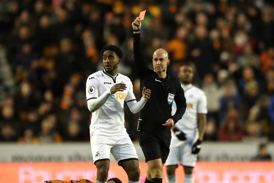 Swansea midfielder Leroy Fer, left, was shown a red card during the FA Cup third-round tie at Wolves