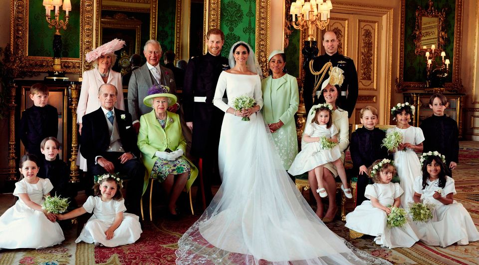 Harry and Meghan (centre) are pictured surrounded by beaming page boys and bridesmaids and (back row, left to right) Camilla, the Duchess of Cornwall; Prince Charles; Meghan’s mother, Doria Ragland; Prince William; (middle row, left-right) Prince Philip; Queen Elizabeth II; Catherine, Duchess of Cambridge; Princess Charlotte and Prince George. Photo: Alexi Lubomirski/PA Wire