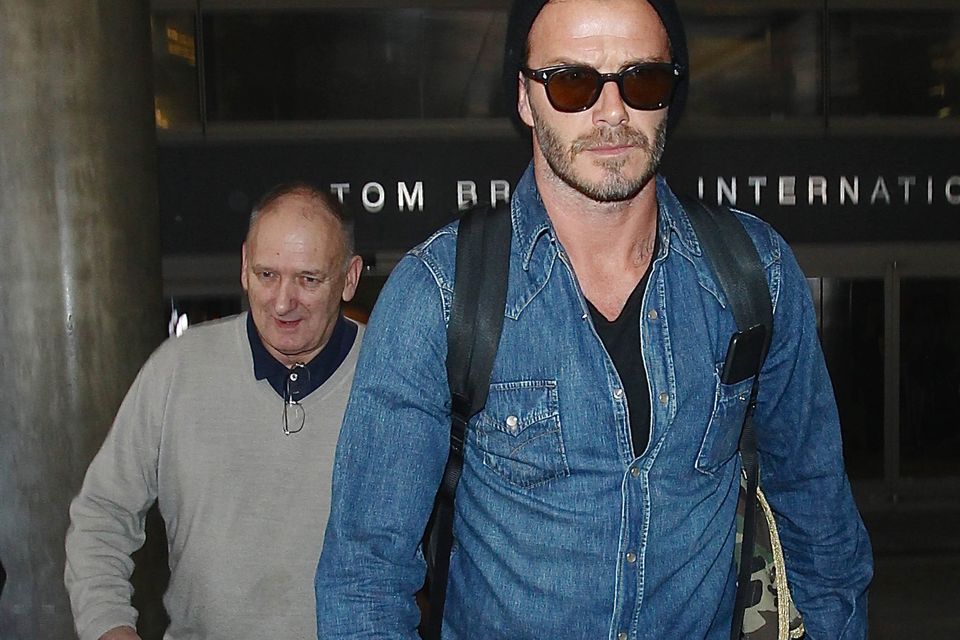 David Beckham, who had to wait 20 years for praise from his father, Ted (behind). Photo: Getty
