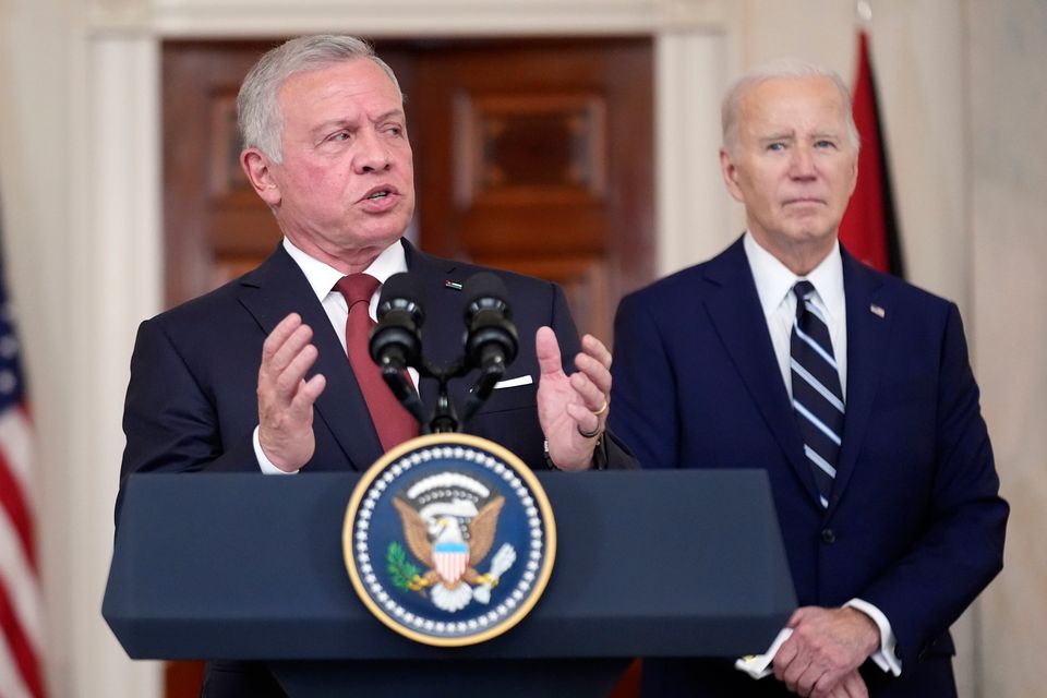 Jordan's King Abdullah II speaks as President Joe Biden listens in the Cross Hall of the White House. Photo: AP