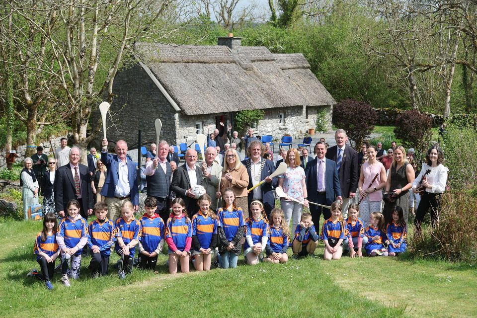 Dr Mary McAleese pictured at the Michael Cusack Heritage Centre in Carron, Co Clare, with representatives of Clare GAA, Munster GAA, the Board of the Michael Cusack Heritage Centre, and students and teachers from Gaelscoil Mhíchíl Cíosóg Inis and Carron National School. Credit Eamon Ward.