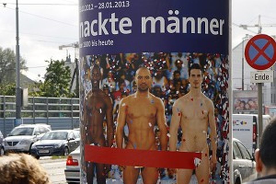 A poster in Vienna advertises an exhibition of pictures and sculptures portraying nude men through the ages (AP)
