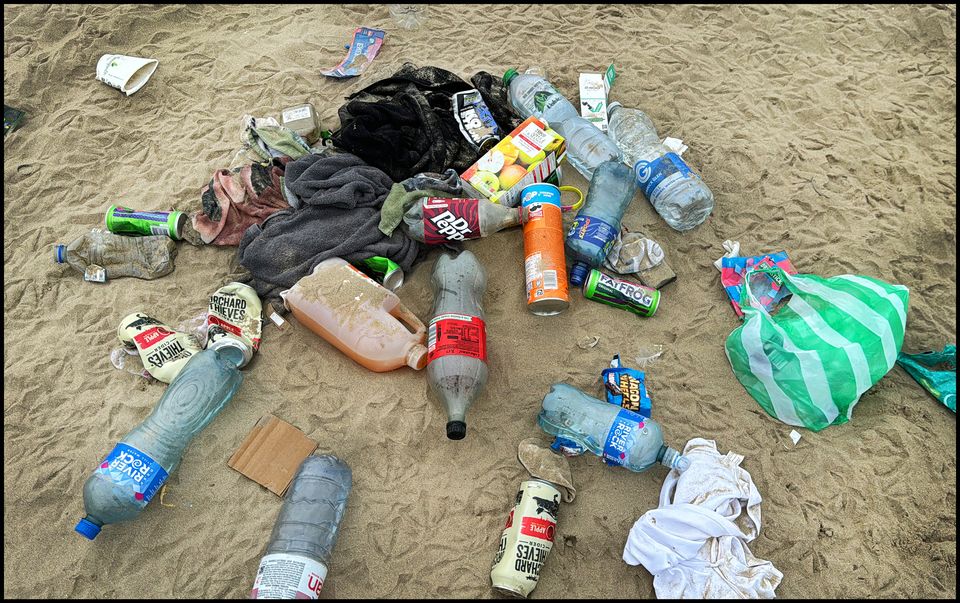 Litter left behind after gardaí cleared crowds from Burrow Beach in Sutton. Pic: Steve Humphreys