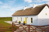 thumbnail: Thatch cottage has been restored and is in pristine condition.