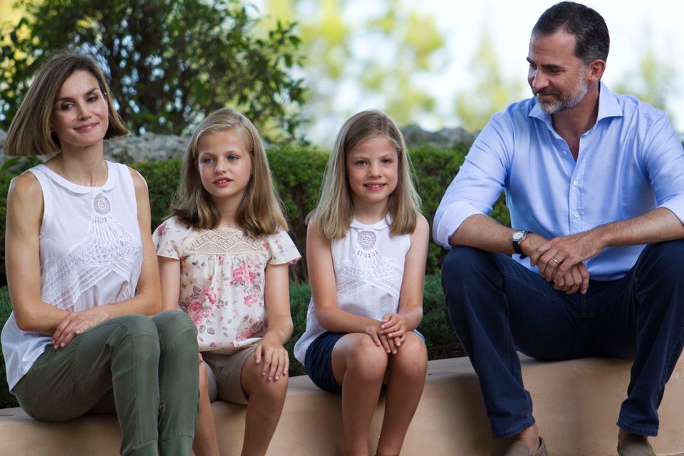 Spanish King Felipe VI (R) and Queen Letizia (L) pose with their daughters Spanish crown princess Leonor (2nd L) and princess Sofia at the Marivent Palace on the island of Mallorca on August 3, 2015. The royal family traditionally spends its summer holidays at the Marivent Palace. AFP PHOTO / JAIME REINAJAIME REINA/AFP/Getty Images