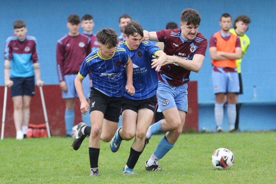 Killian Tierney of Ferns United tries to shake off the attentions of Camolin Celtic duo Hughie Doyle and Tom Waugh.