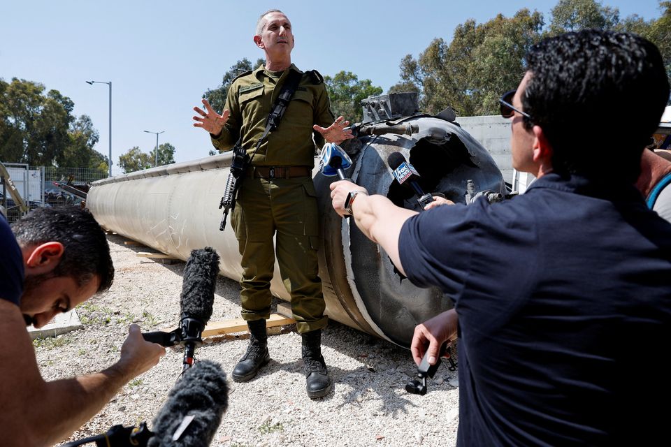 Israeli military spokesperson Daniel Hagari displays what the defence forces say is an Iranian ballistic missile retrieved from the Dead Sea. Photo: Reuters