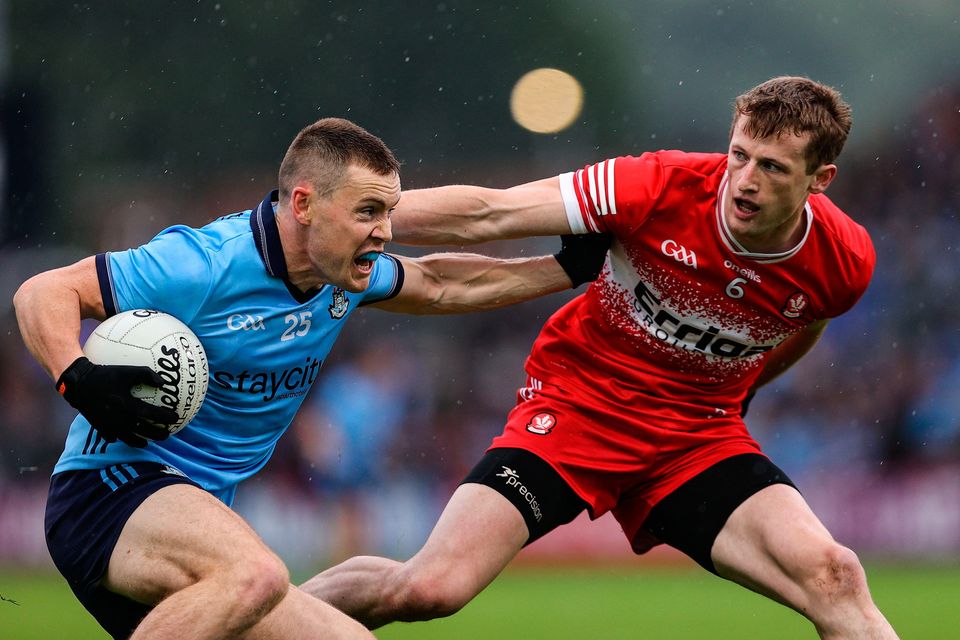 Dublin talisman Con O'Callaghan is shadowed by Brendan Rogers of Derry during the All-Ireland SFC Round 3 match in Newry. Photo by Thomas Flinkow/Sportsfile