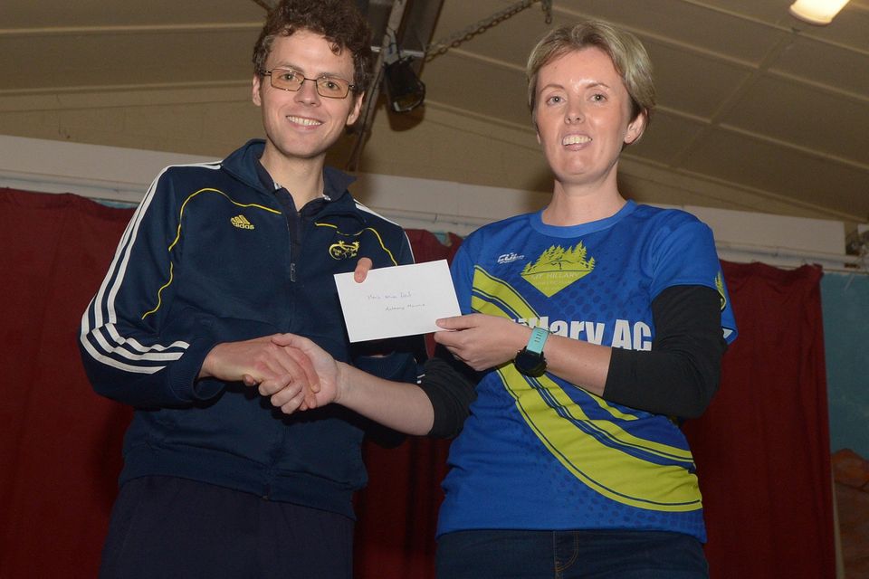 Mount Hillary 5 Mile Road winner Anthony Mannix receives his prize from Deirdre Fallon, Mount Hillary AC. Picture John Tarrant