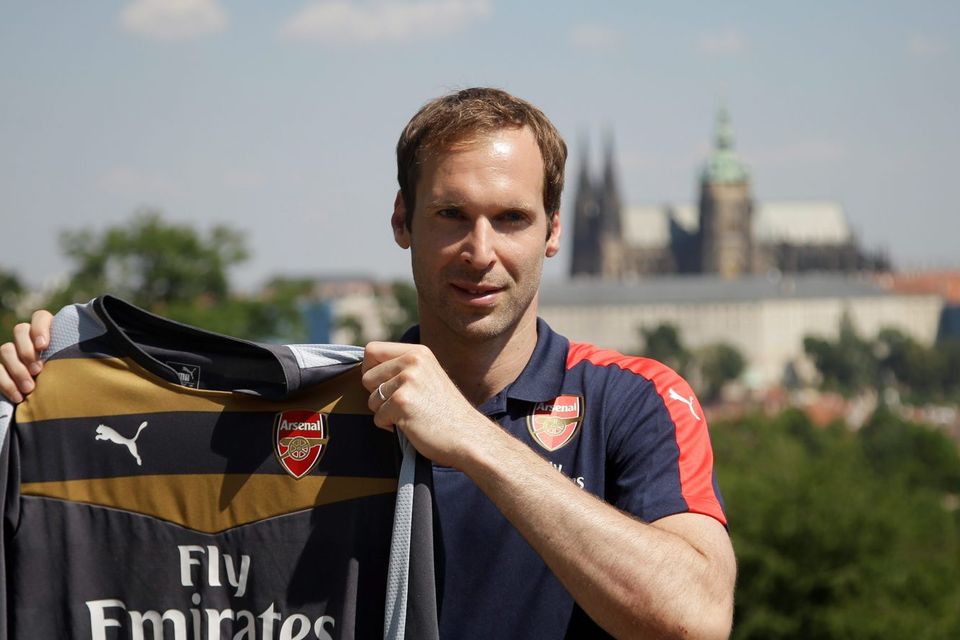 Czech Republic's goalkeeper Petr Cech presents his new Arsenal jersey after a press conference in Prague