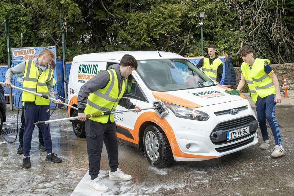 Students hard at work at the Scoil Chonglais Parents Council's car wash fundraiser at O' Reilly's in Baltinglass. Photo: Joe Byrne
