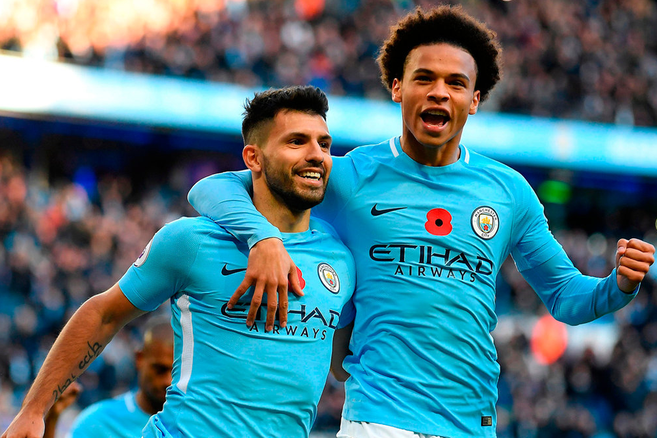 Sergio Aguero is congratulated by Leroy Sane after scoring Manchester City’s second goal. Photo: Getty Images