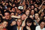 thumbnail: Fans cheer on their idols as U2 perform their Zoo TV gig at the RDS in Dublin. Davidw Mullen (now 39), wearing the black-and-white cap, had just finished his Leaving Cert