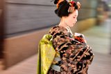 thumbnail: A maiko, or apprentice geisha, walks between teahouses in Gion, Kyoto