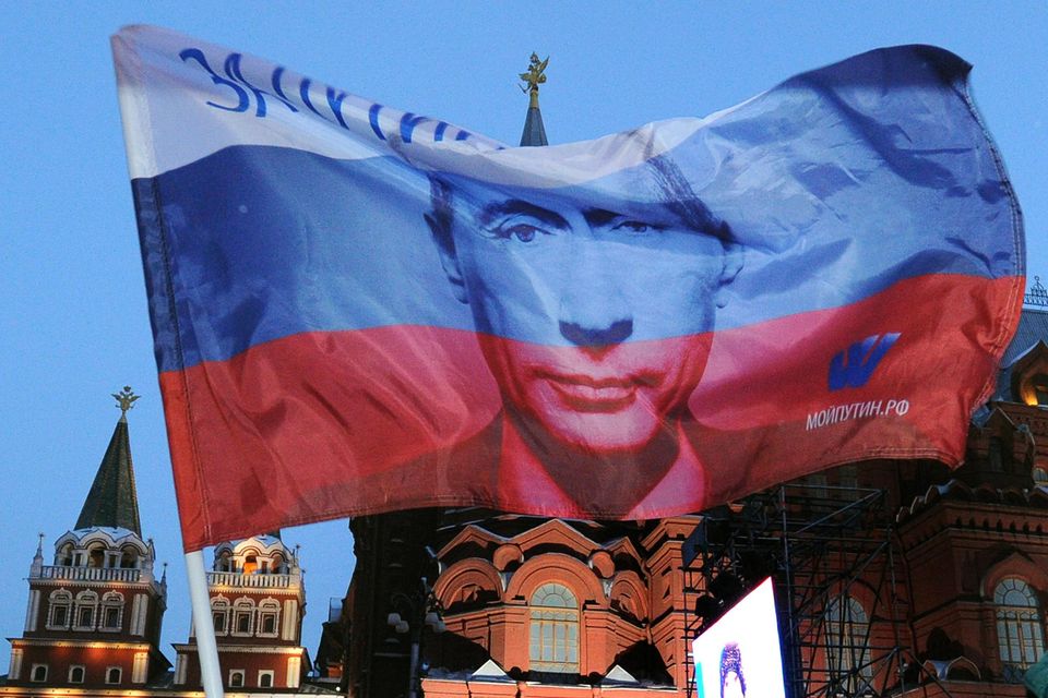 Supporters celebrate Vladimir Putin’s tainted election victory in 2012. Photo by Alexander Nemenov via Getty