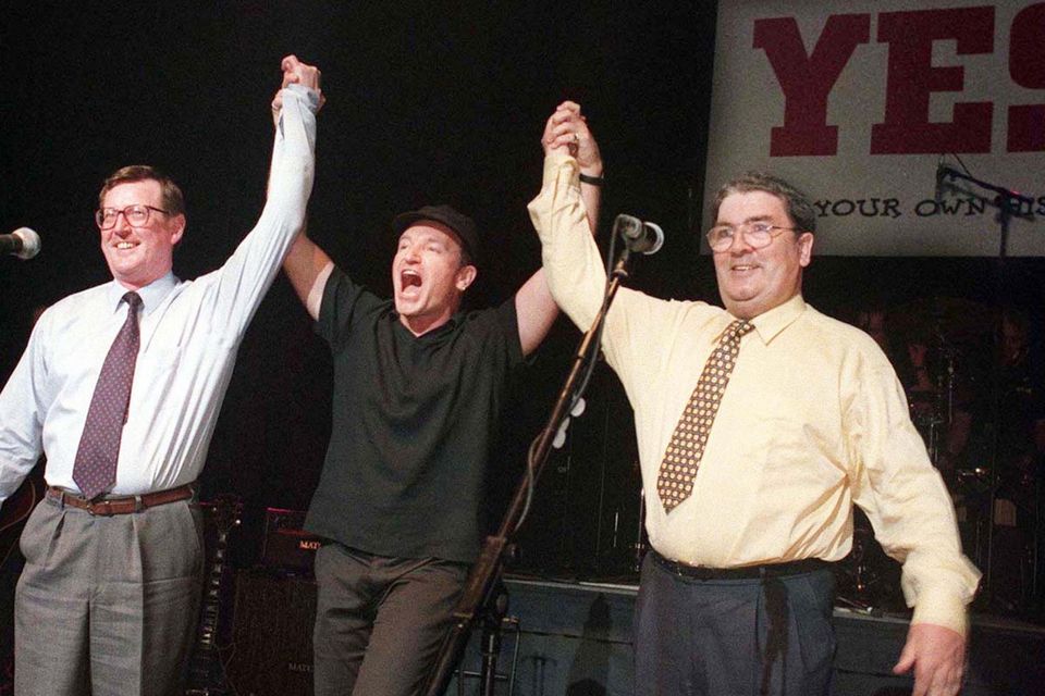 Unionist leader David Trimble, SDLP leader John Hume and Bono together on stage at the Waterfront Hall in Belfast for a concert to promote a Yes vote in the Good Friday Agreement referendum. Photo by Paul Faith