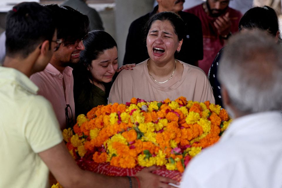 Relatives of Air India crash victims provide DNA samples as they wait to receive remains