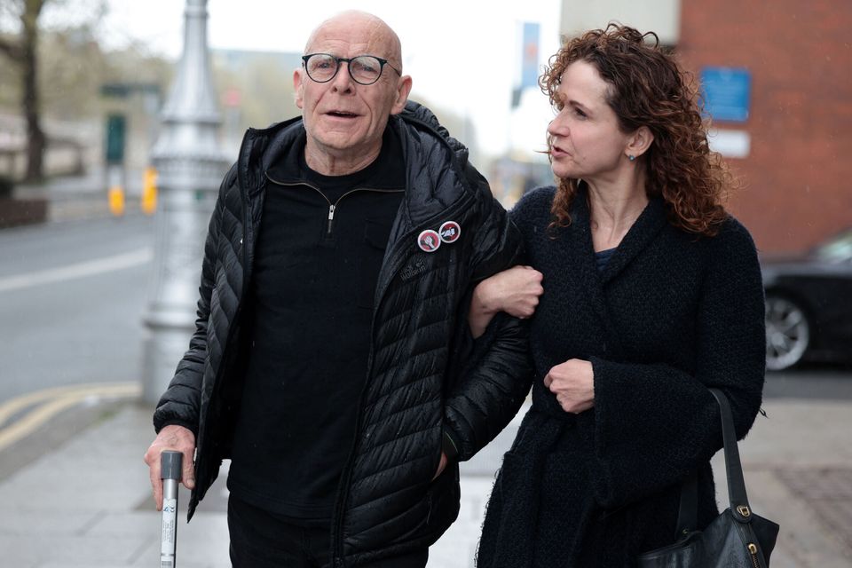Irish Times journalist Kitty Holland with her father, activist Eamonn McCann, at court. Photo: Leah Farrell/RollingNews.ie
